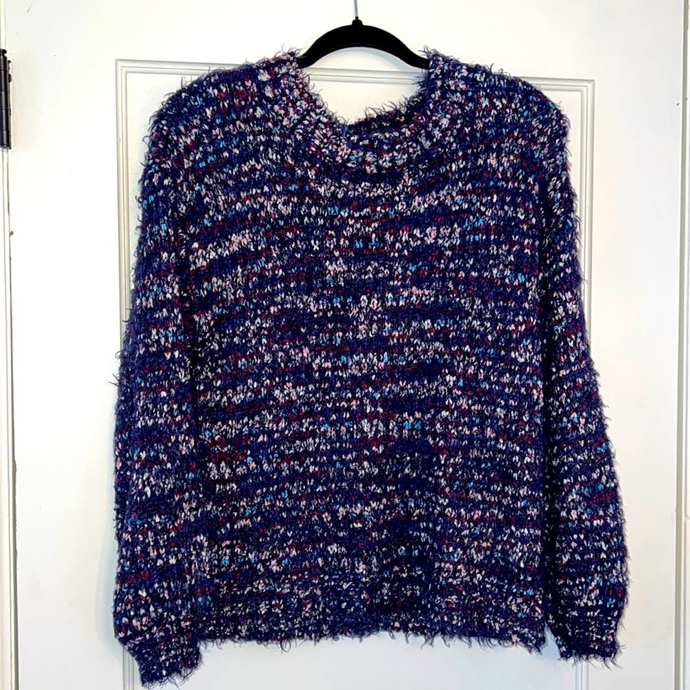 Multi-Colored sweater, 100% polyester. Cozy and comfy